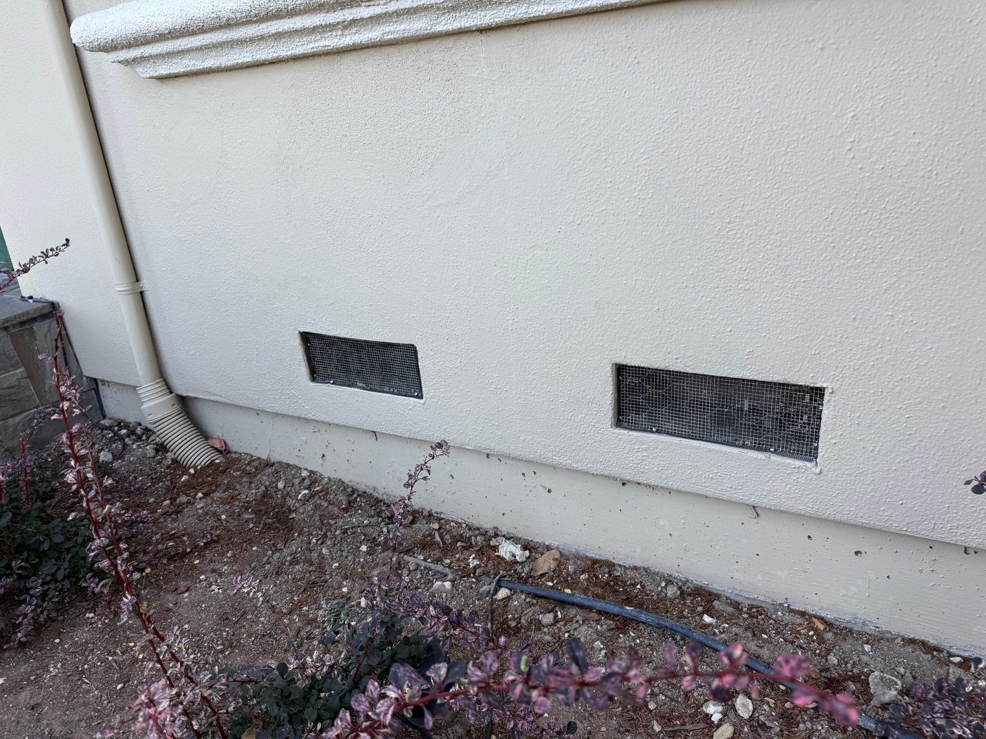 After: foundation vents retrofitted with ember-resistant mesh, fully sealed
